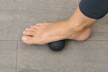 Proper rolling technique targets plantar tension without aggravating tired feet.